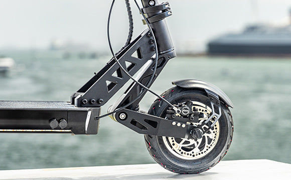 Close-up of black electric scooter wheel